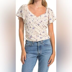Astr Flutter Sleeve Faux Wrap Top in Periwinkle Floral